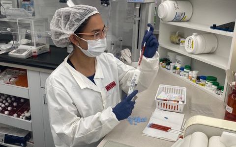 image of woman making a compounded medication
